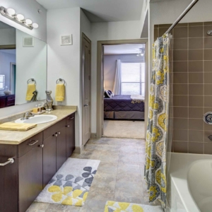 La Frontera 2 bedroom model bathroom with deep soaking tub and single sink vanity
