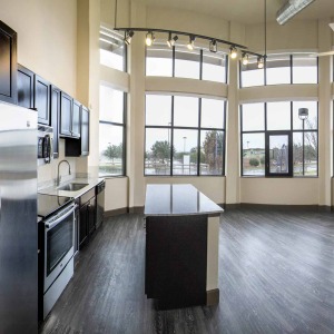 Loft Kitchen and Living area at la frontera Plank flooring and stainless appliances