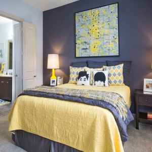2 Bedroom Model Home Bedroom with Grey and Yellow color scheme and modern furnishings